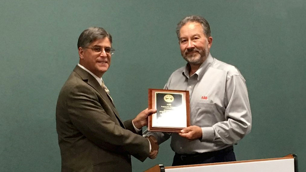 Tom Carpenter, Plant Manager, Accepts Tennessee OSHA Governors Award for Excellence on behalf of the Employees of ABB Rogersville from Tennessee OSHA Representative David Blessman on May 15, 2019.