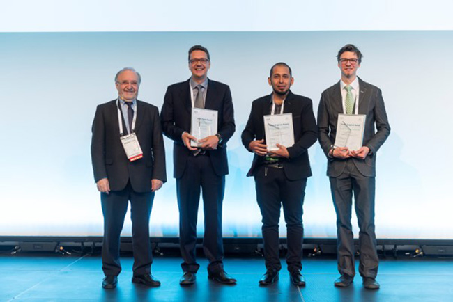 ABB Corporate Research scientist Jürgen Schuderer (second from left) receives the prestigious PCIM Europe 2019 best paper award for the ABB publication ”High-Power SiC and Si Module Platform for Automotive Traction Inverter“ [1].