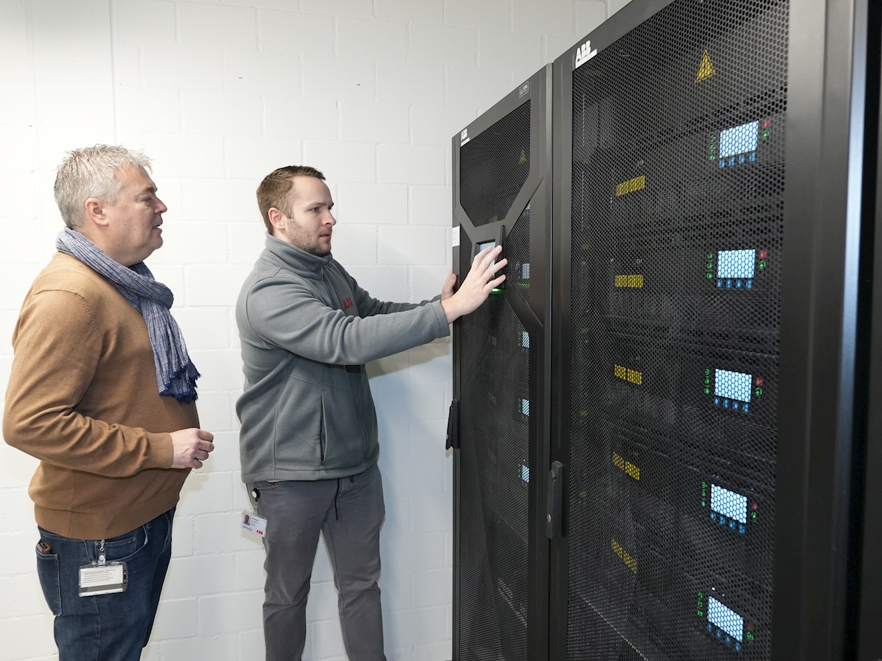 Dani Anderegg, KSB, and Lynn Erlinghagen, ABB, at one of the UPS systems in the new building.