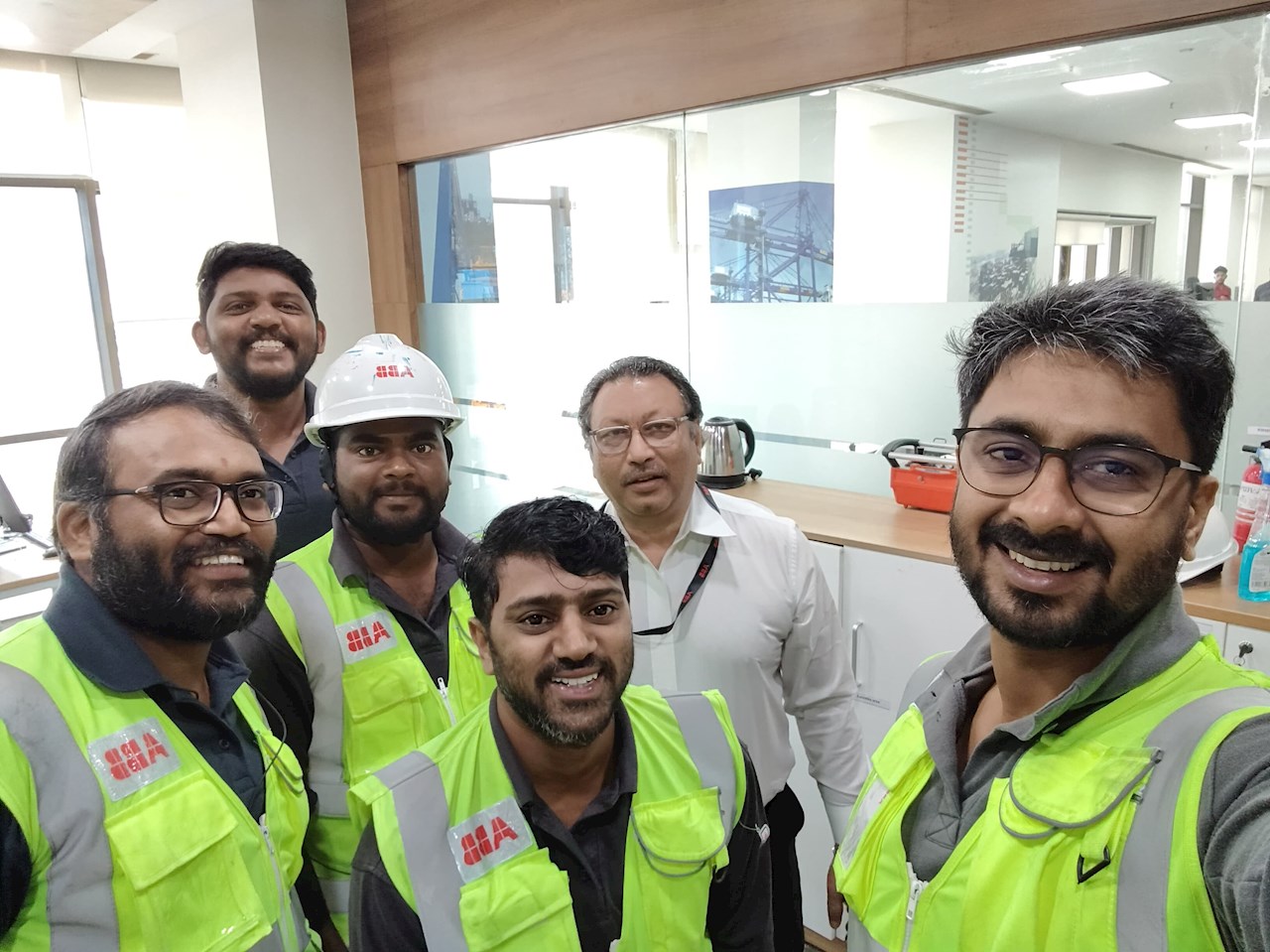 Jampala Raghuram, Regional Manager, Ports, ABB’s Marine & Ports division,
with the ABB team at Adani Vizhinjam Port. Image credit: ABB